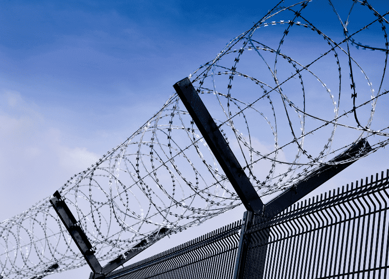 Outer security fencing + internal controlled perimeter
